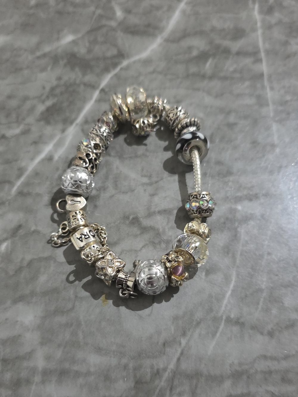 7-inch Pandora-style bracelet with a genuine Pandora bead (see photos).
